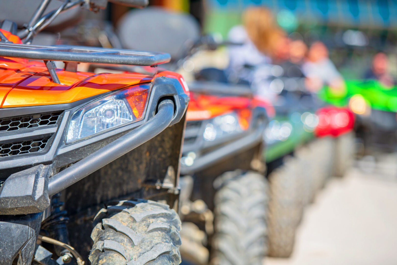 Close-up of colorful ATVs lined up